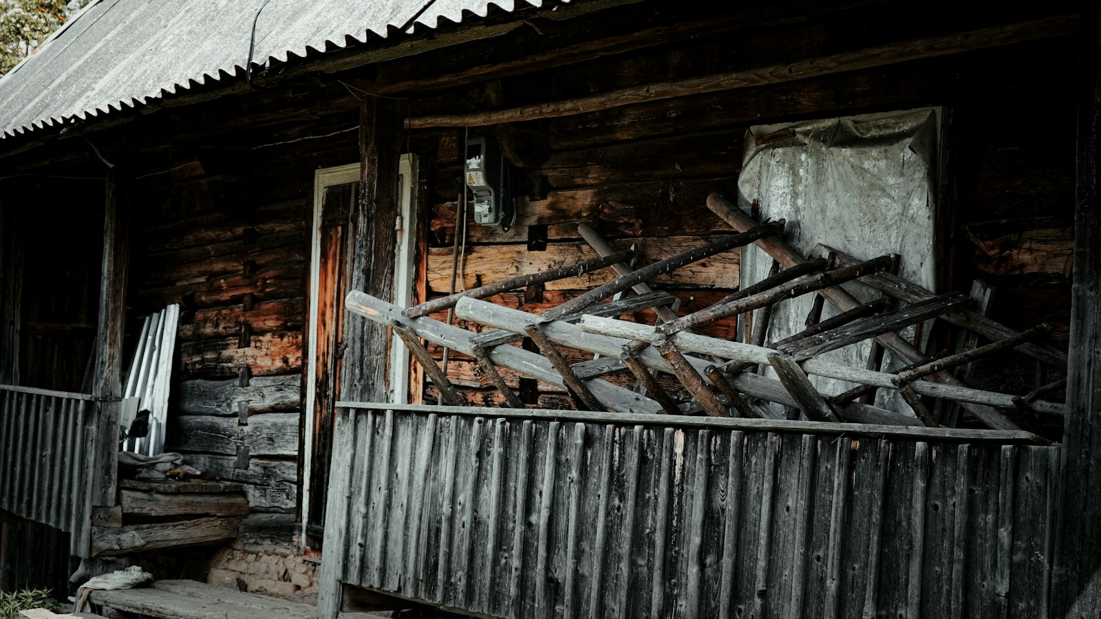 Illustrative photo of a weathered wooden house exterior
