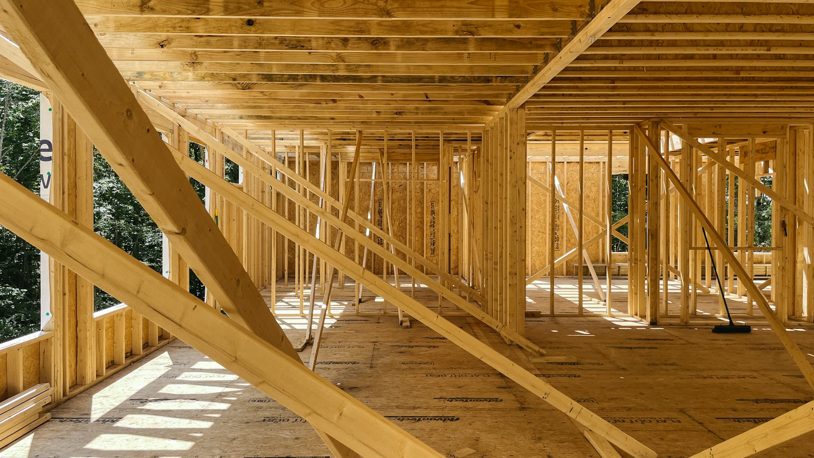 Illustrative photo of a home’s timber interior framing during construction